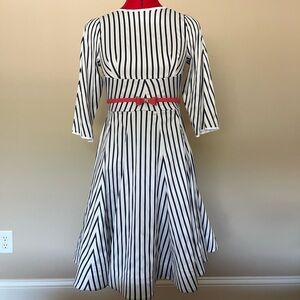 Midi dress. Satin like material. Belt not included.